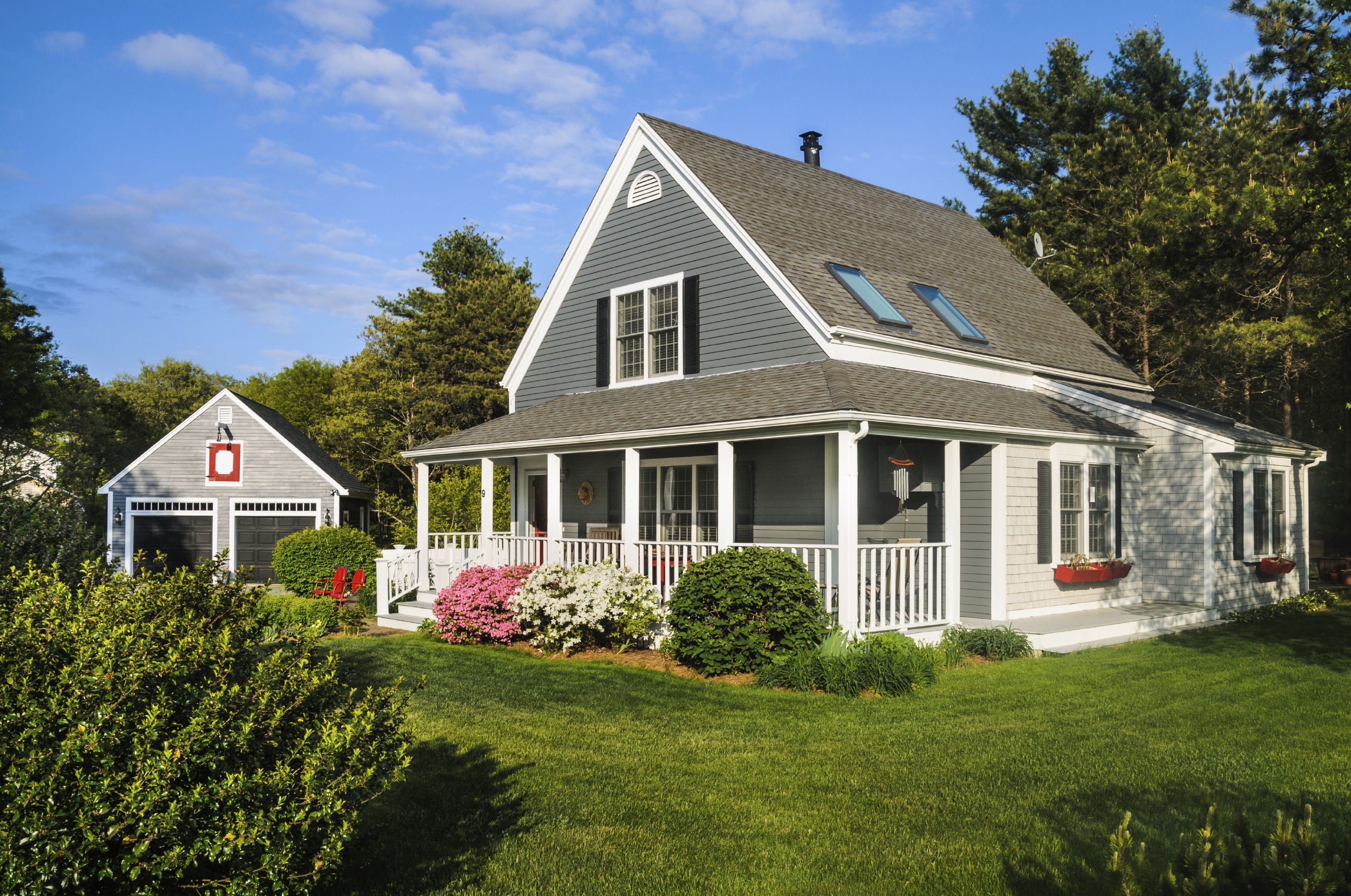 A small home with a front porch on Cape Cod on a May afternoon.