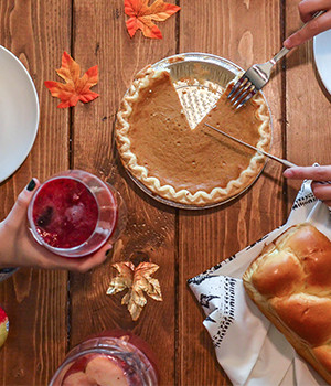 Photo of people enjoying Thanksgiving dinner