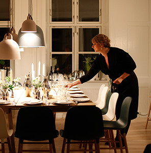 Photo of woman setting the table