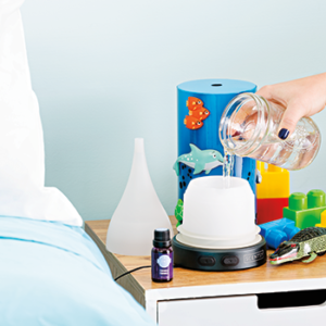 woman adding water into the deep blue sea diffuser
