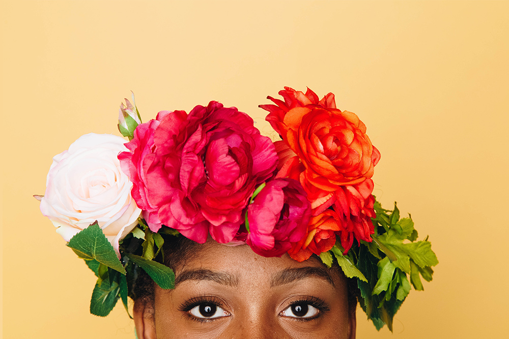 photo of woman wearing a floral crown