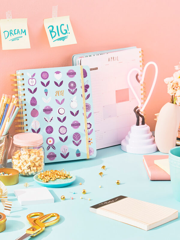 Photo of Scentsy planner on desk with motivational sticky notes, dream big!