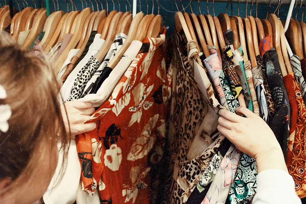 photo of woman searching clothes closet