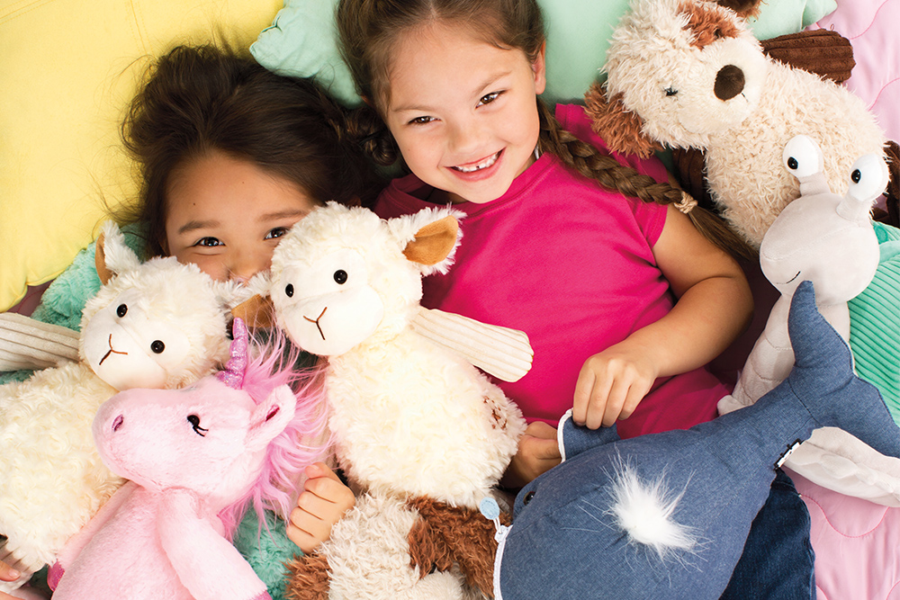 Photo of Kids in a pile of Scentsy Buddies