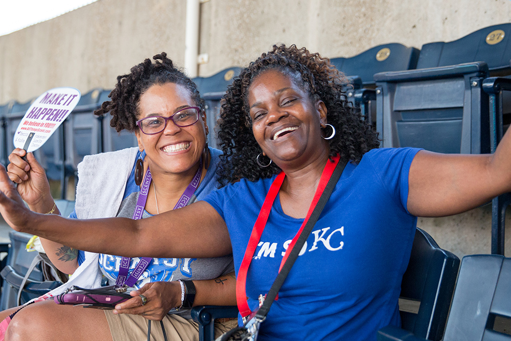 Consultants smiling from the stadium at SFR