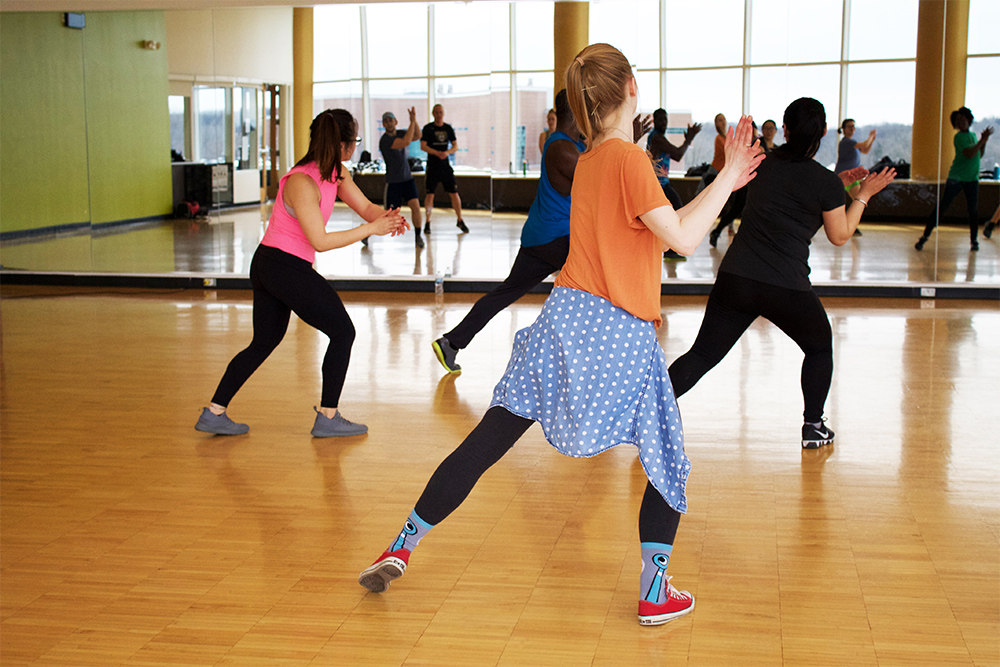 Photo of friends taking exercise class together