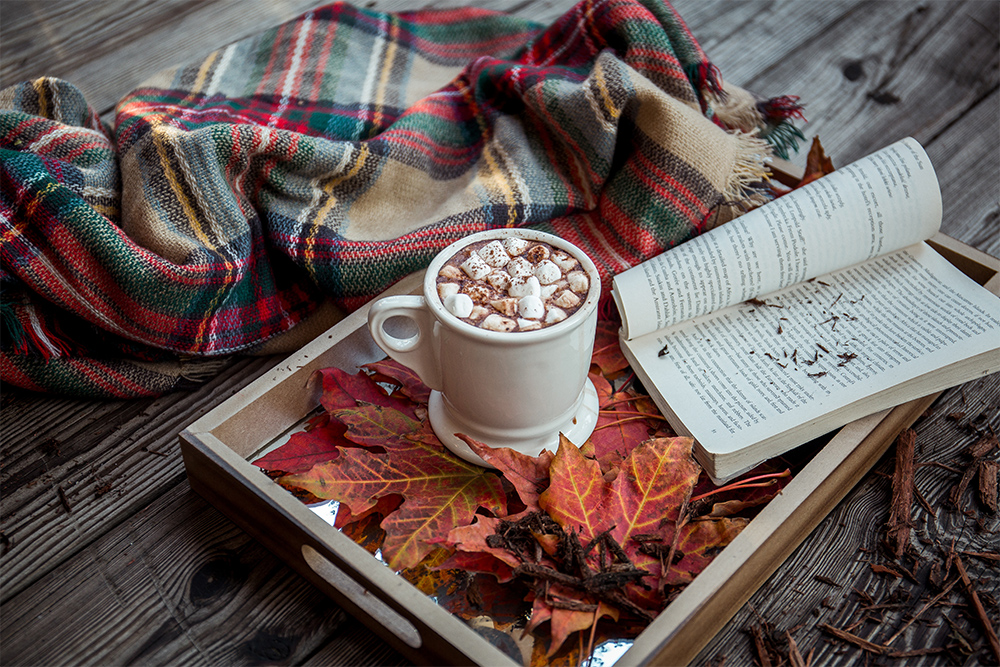 Photo of hot chocolate and book