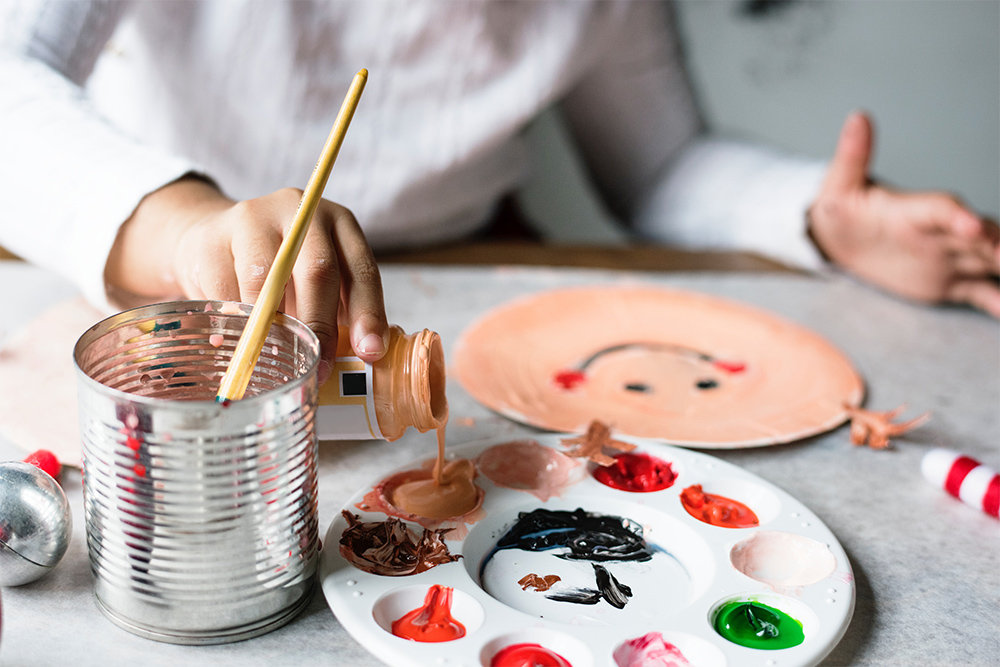 Photo of kids crafting and painting at a table