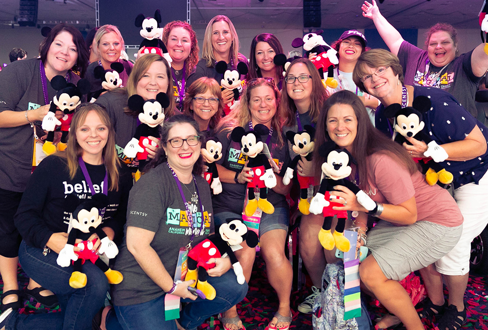 photo of dozens of consultants showing off their scentsy mickey buddy