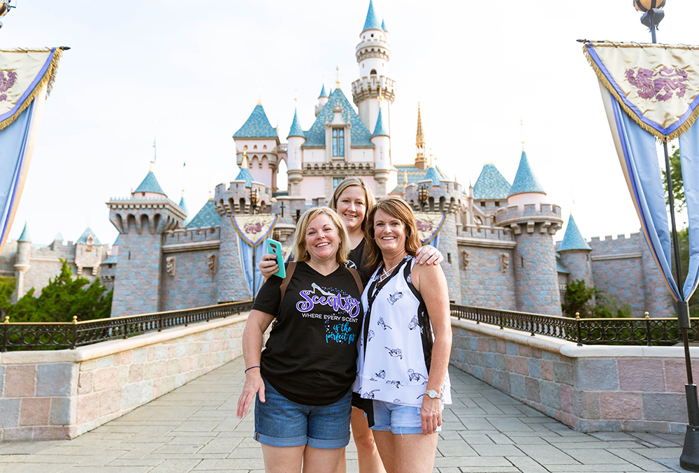 photo of consultants during Scentsy Family Reunion in front of Cinderella's castle in Disneyland 
