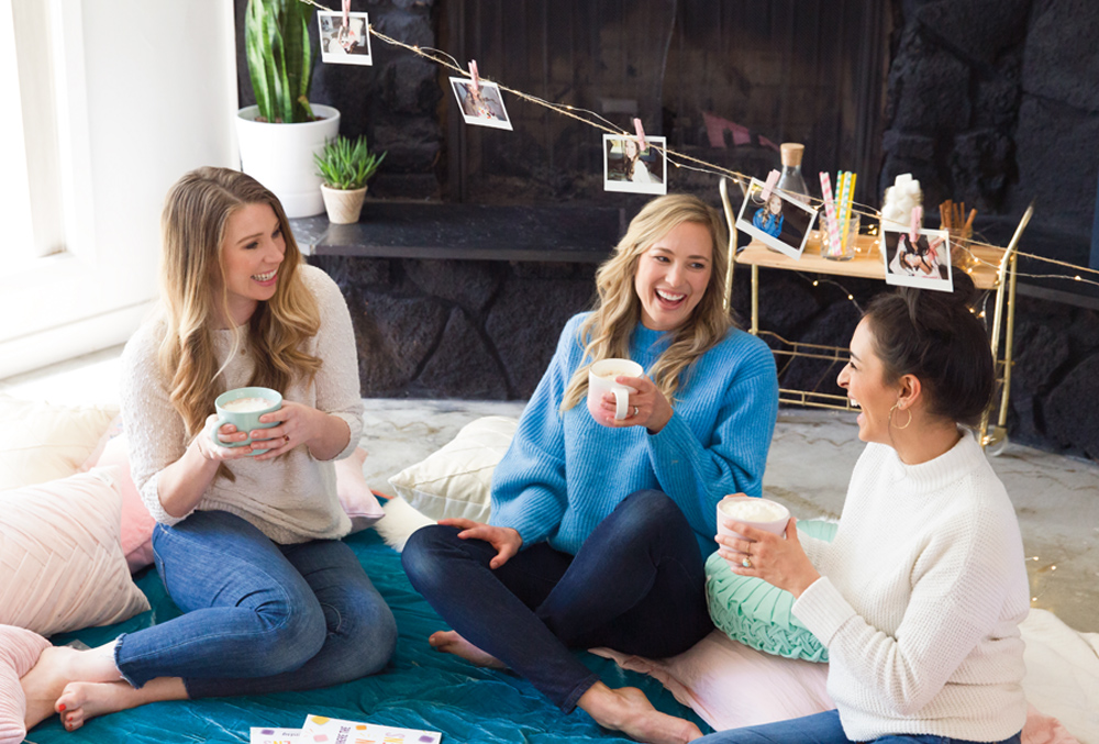 consultants laughing at a hygge themed scentsy party