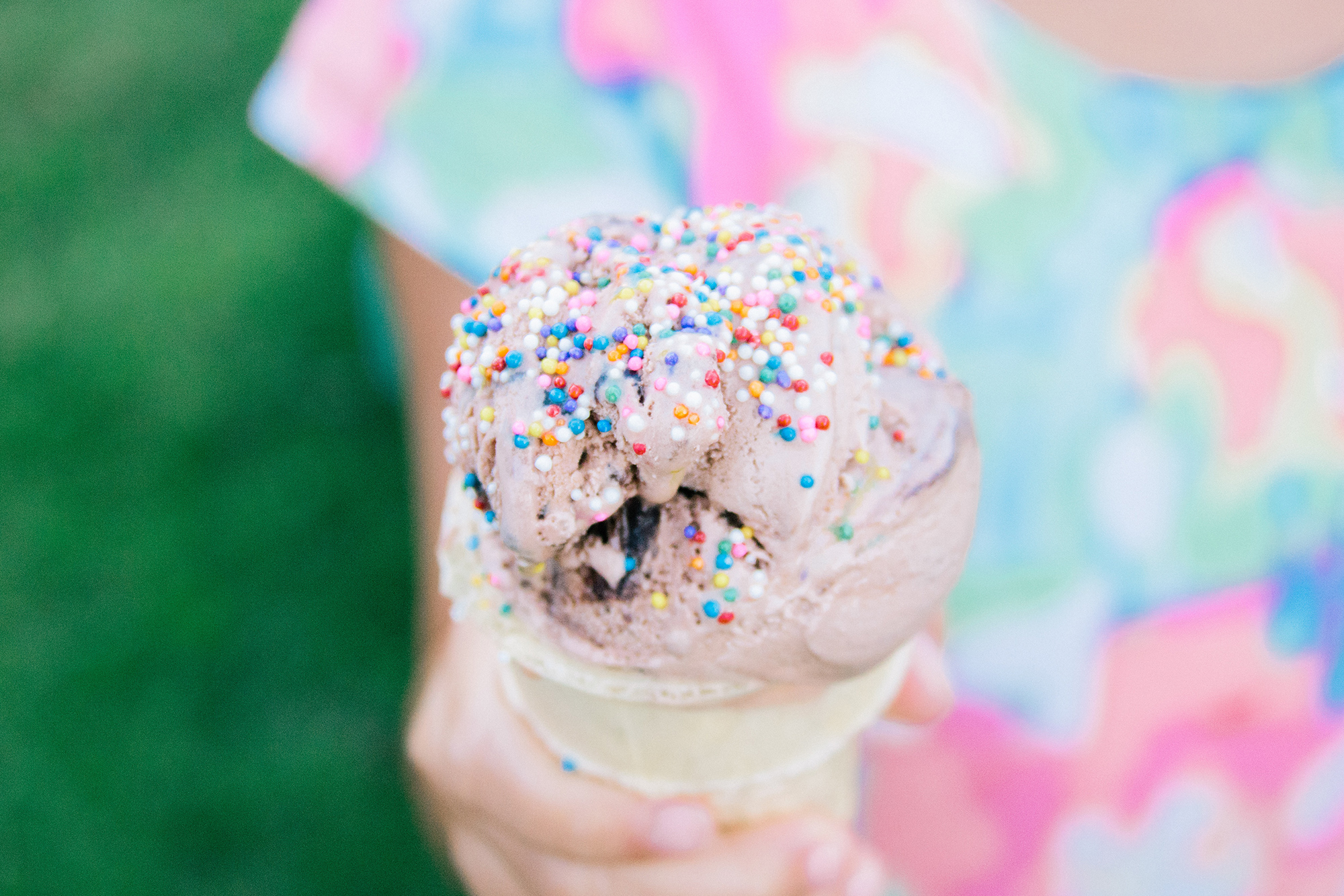 little girl holding ice cream cone