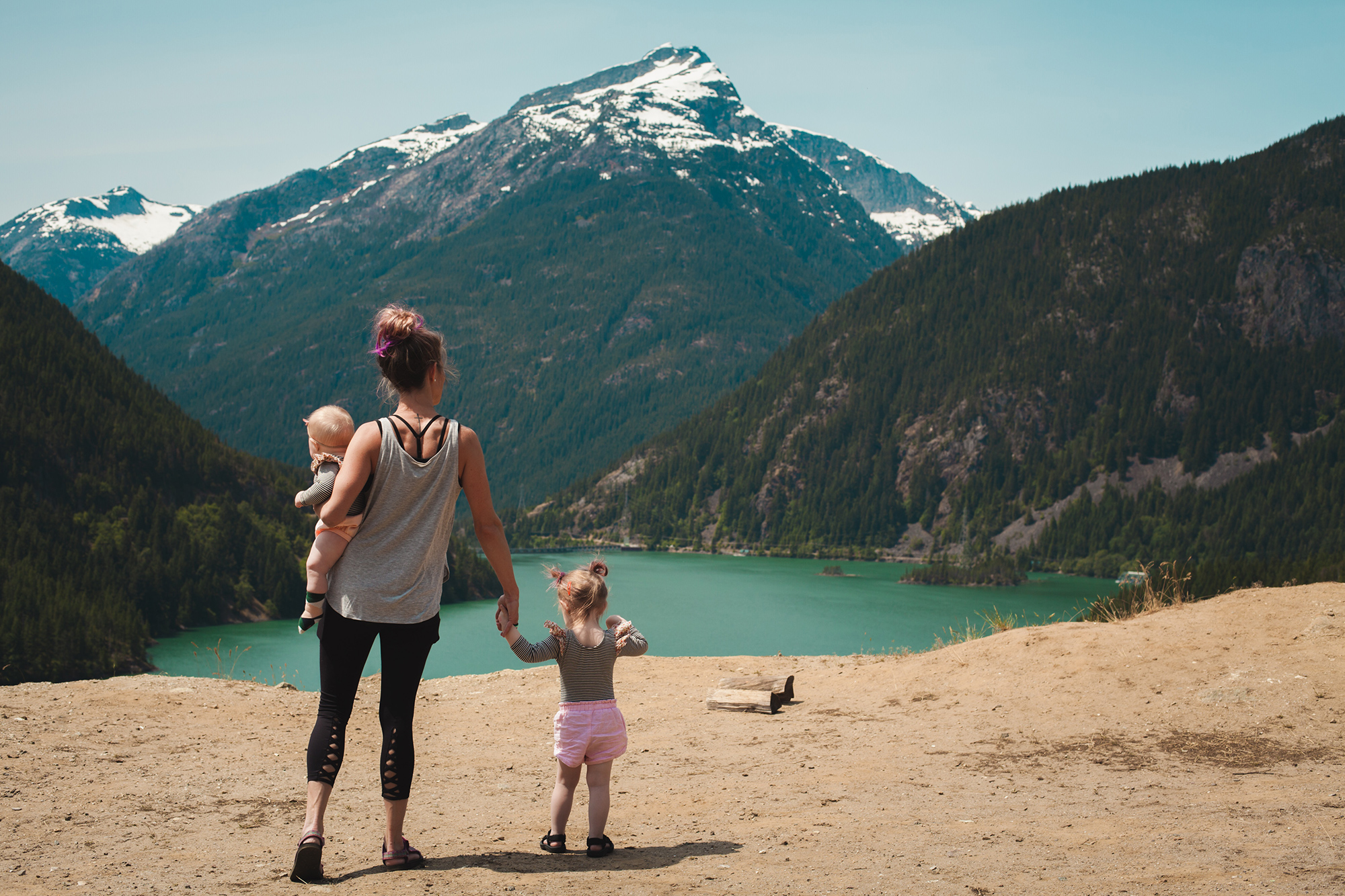 Mother and kids standing over a scenic park view