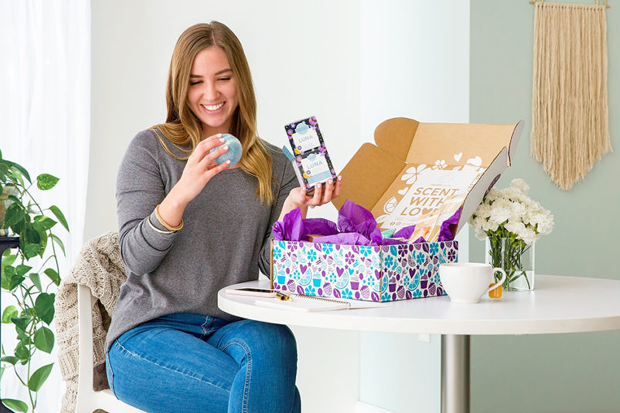 Woman is happy to be opening a whiff box