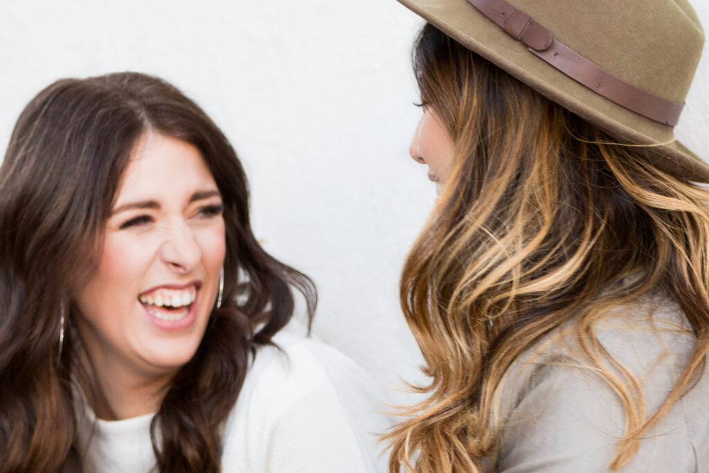 Two friends laughing with each other