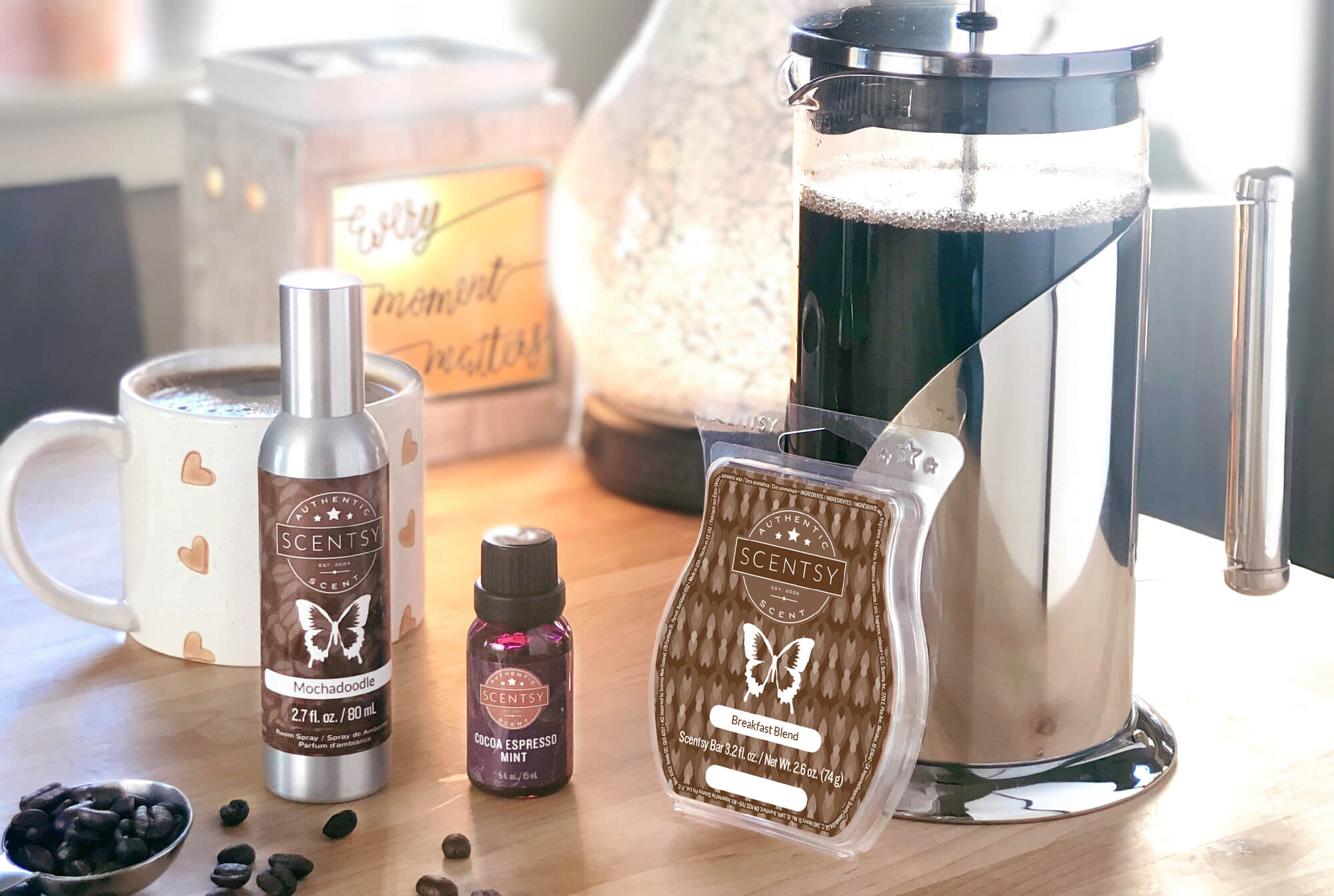 9/26 blog post photoshoot featuring - Every Moment Matters Warmer, Enchant diffuser, Mochadoodle Room Spray, Cocoa Espresso Mint Natural Oil, and Breakfast Blend Scentsy Bar