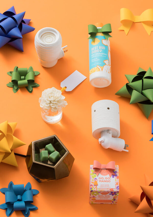 Under $25 Scentsy products featuring - Spin Wall Fan Diffuser, Honey & Chamomile Best Bud Suds Pet Shampoo, Luna Fragrance Flower, Etched Core Mini Warmer, Midnight Copper Warmer, and Go, Go, Mango Bath Bomb