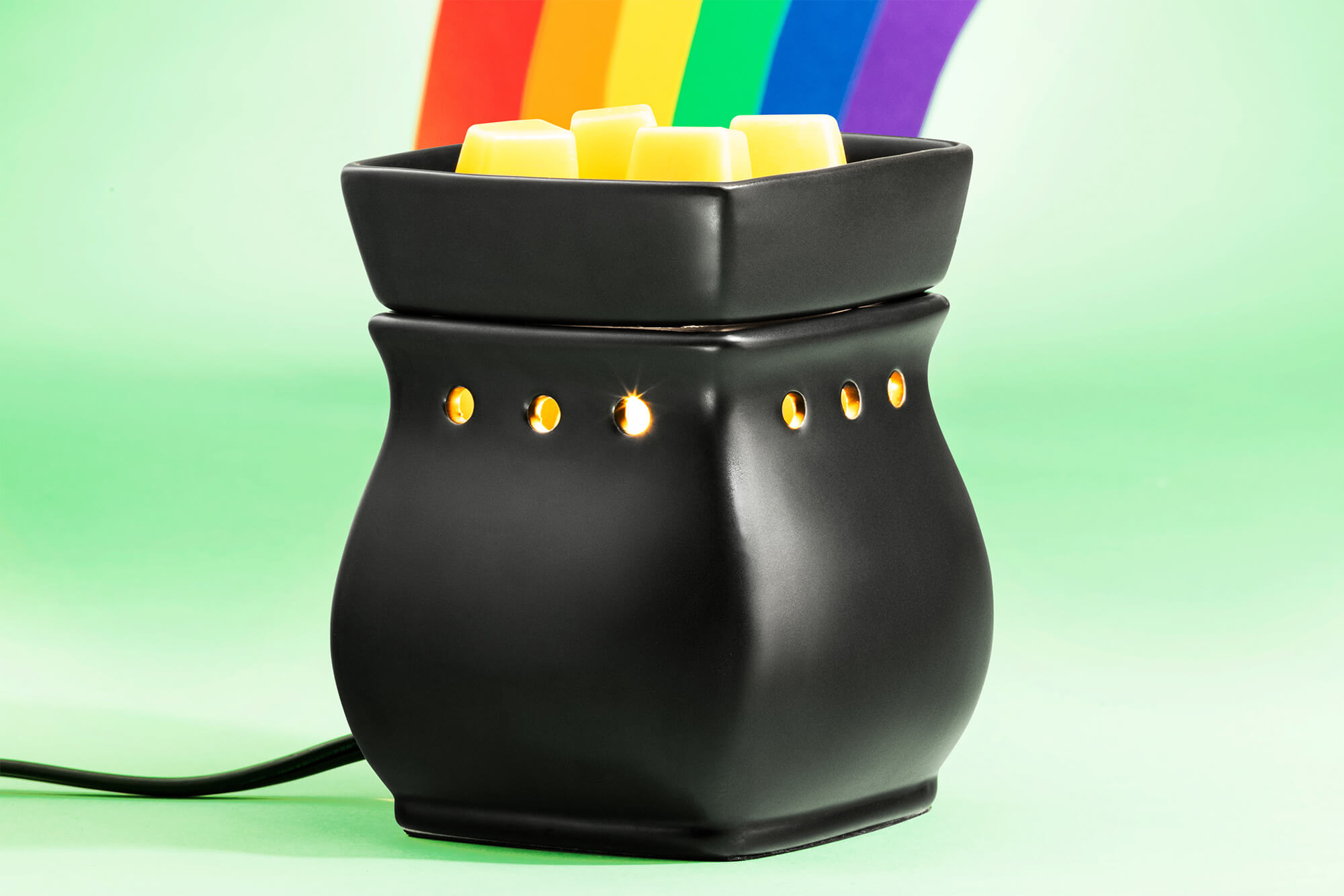 Scentsy's Classical Curve Black Satin warmer with a rainbow coming from it like a pot of gold