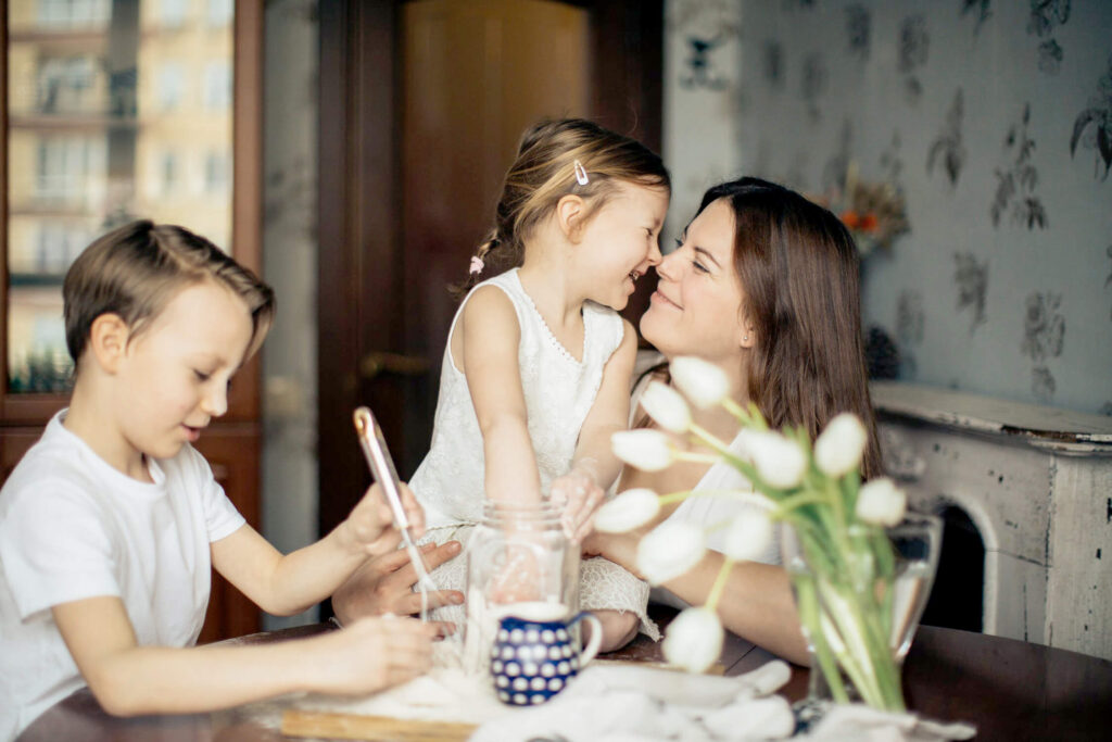 Mother and children sitting at dining room table