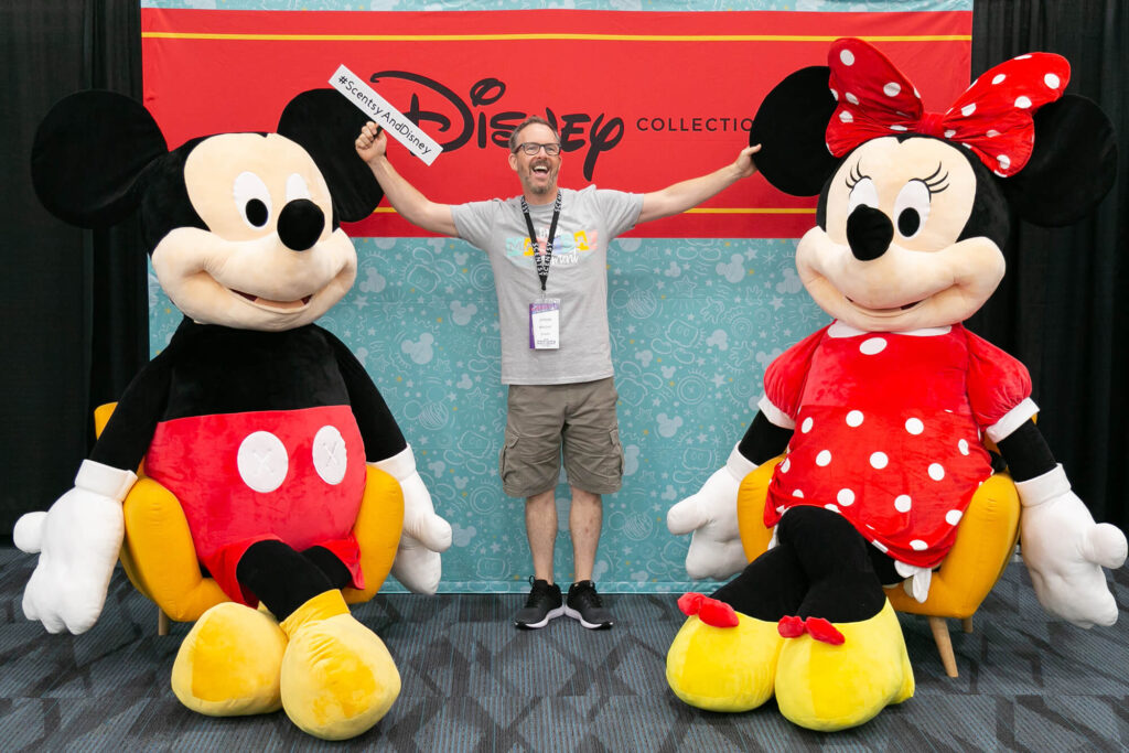 Jason posing with Mickey and Minnie Giant Scentsy Buddies