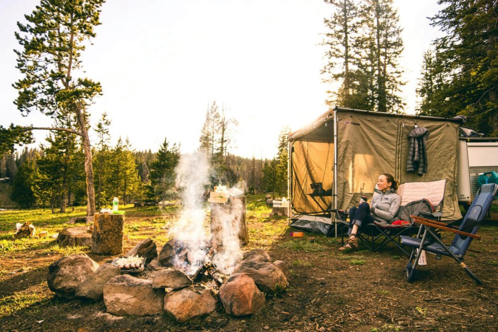 Campsite with smoke coming from firepit