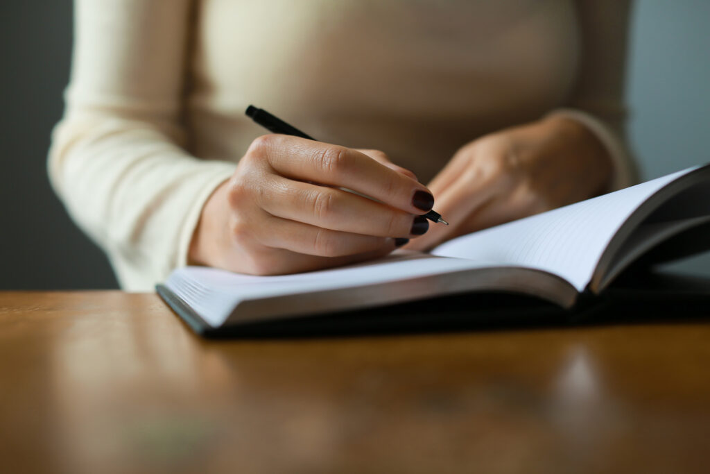 Person writing in a journal