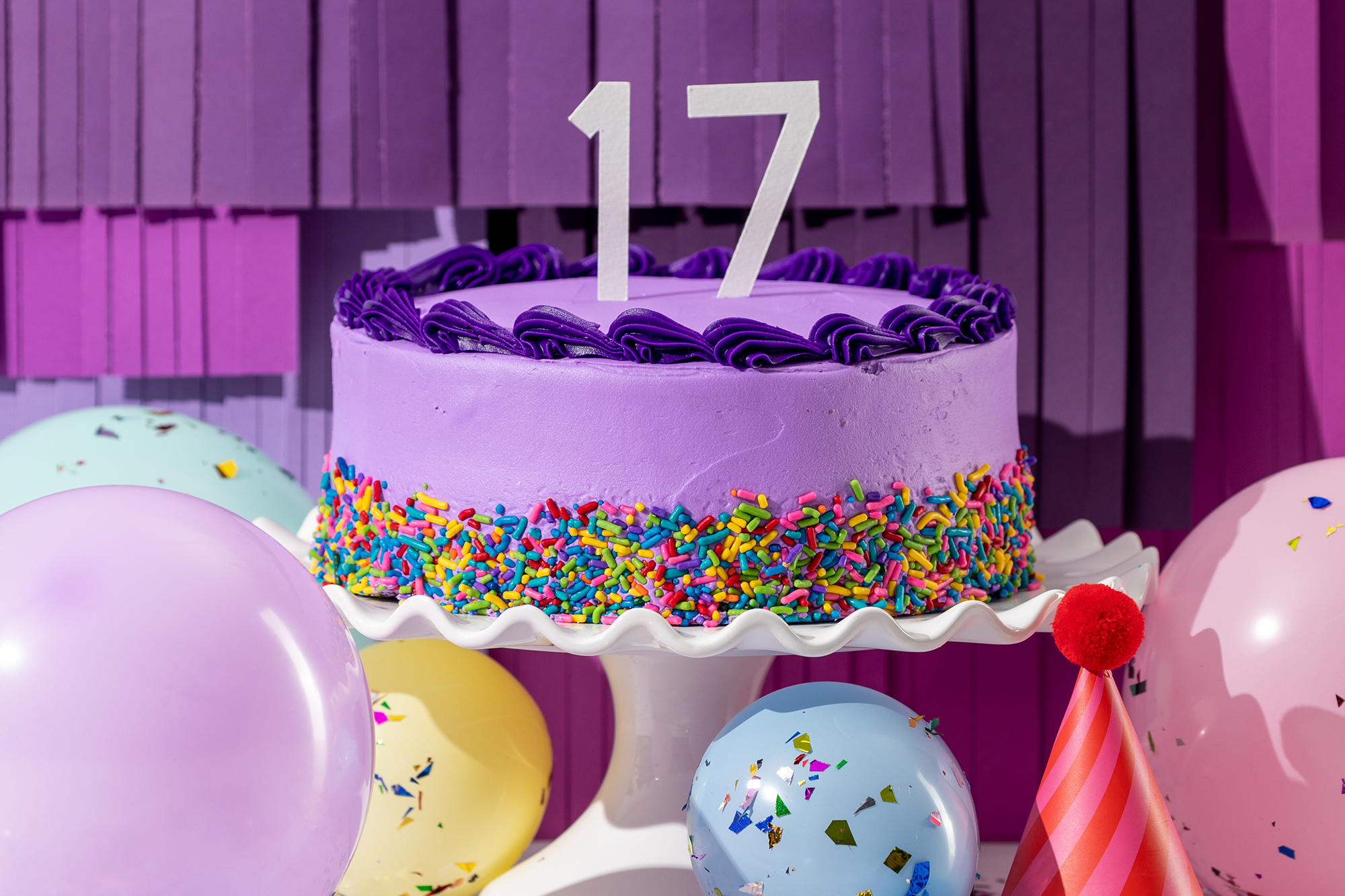 Scentsy's 17th birthday cake with balloons around