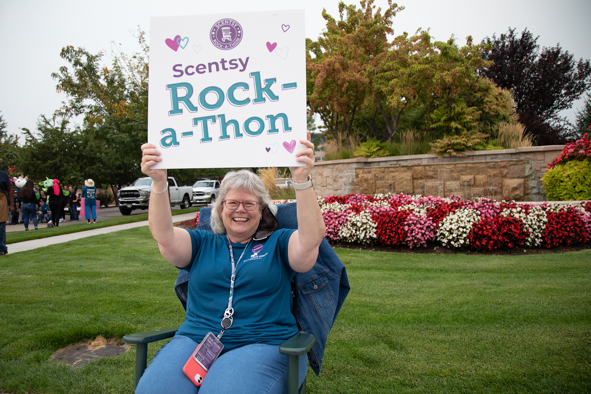 Scentsy Rock-a-Thon: Person rocking holding a sign