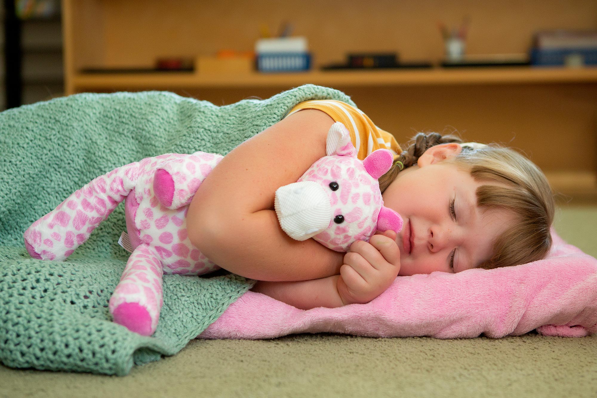 little girl sleeping with pink giraffe Scentsy Buddy
