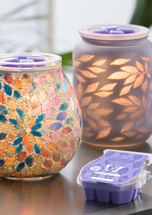 Scentsy Pearlescent Petals Warmer, Unbe-leaf-able Warmer, and French Lavender wax bar in a stylized photo.