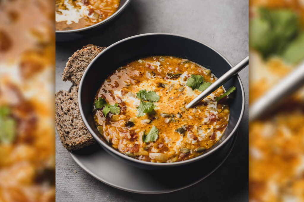 A bowl of Pumpkin Chili with a side of bread