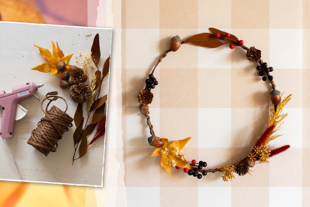 A homemade autumn wreath made with floral wire, a dinner plate, fall foliage including acorns, berries and pinecones pieced together with a hot glue gun