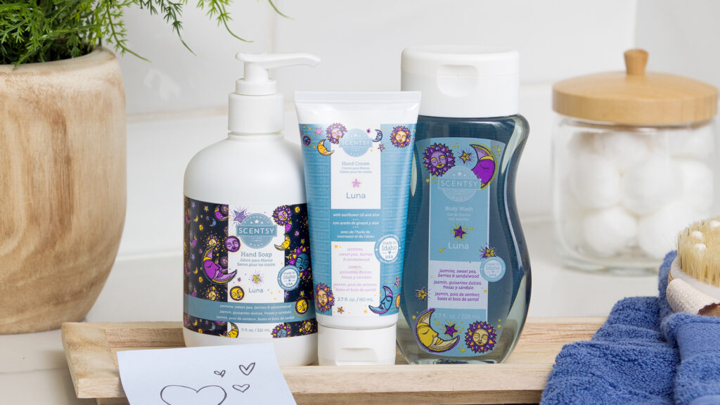Luna scented body products including hand soap, hand cream and body wash sitting on the bathroom counter with a note with hearts on it