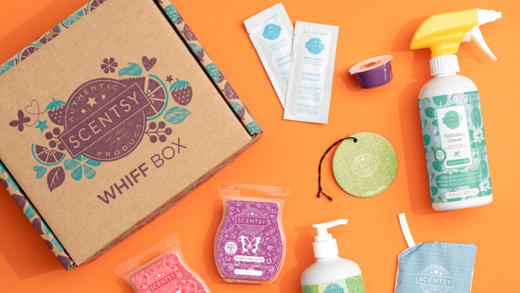 Scentsy whiff box with all of the scent products scattered around the box