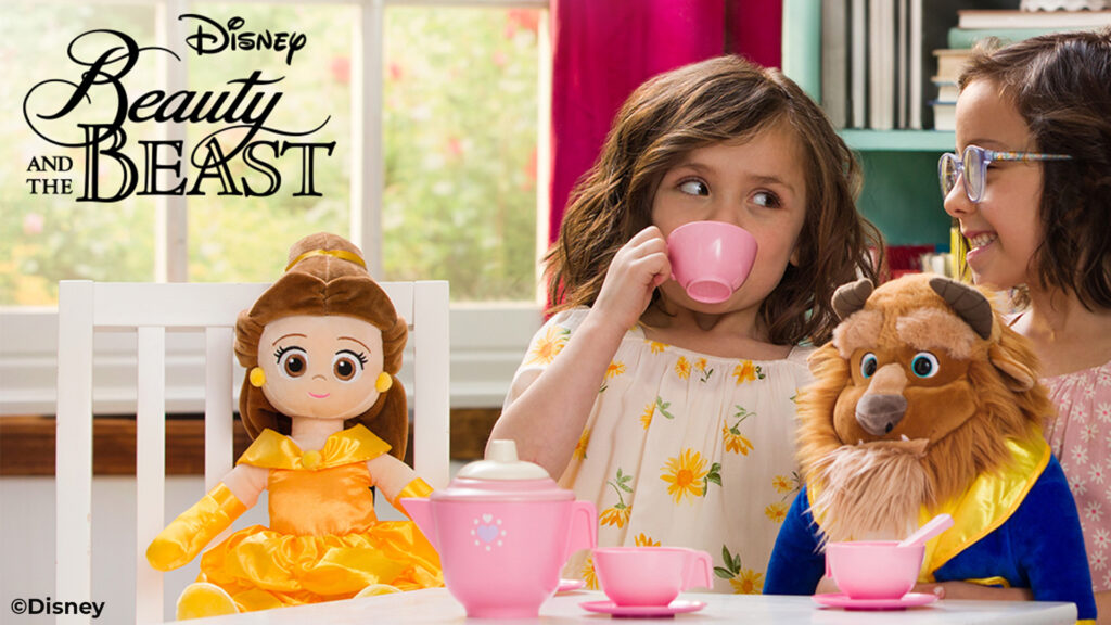 Disney Belle and the Beast Scentsy Buddy stuffed animals sitting at a table with two little girls having a tea party