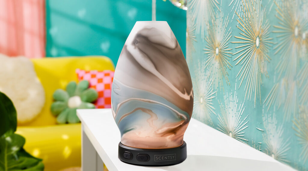 Scentsy diffuser releasing essential oils into the air in a living room