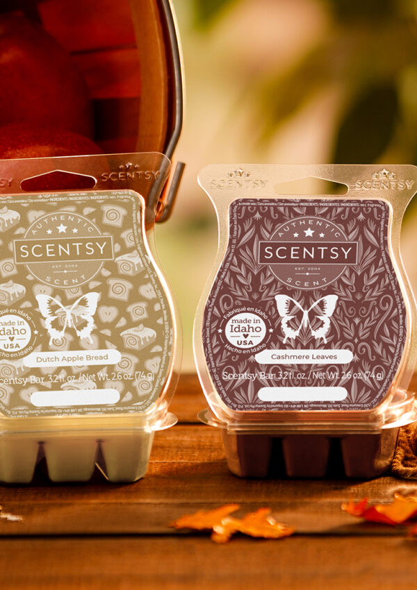 Scentsy wax bars scented in Cashmere Leaves & Dutch Apple Bread sitting on a fall decorated table with spices, a bucket of apples and leaves