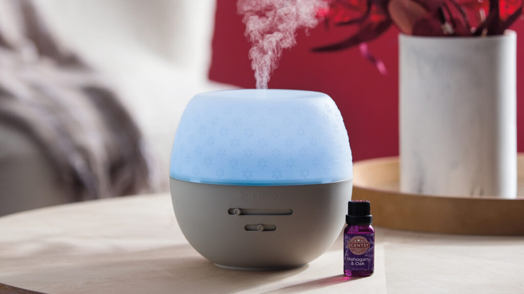Scentsy diffuser releasing mahogany and oak scented essential oils
