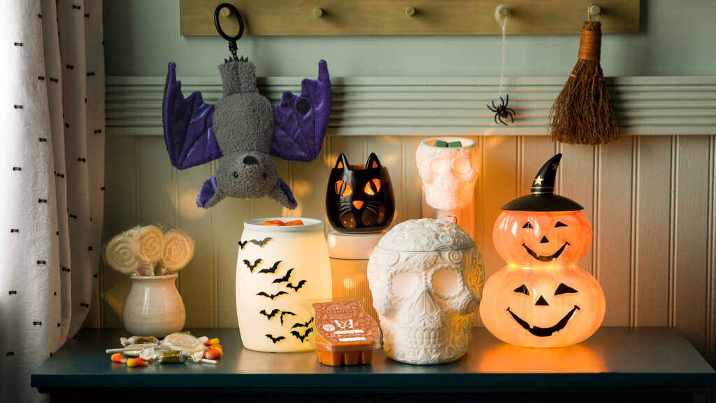 Products from Scentsy harvest collection including wax warmers, mini warmers, fall scented wax melts and a bat buddy clip