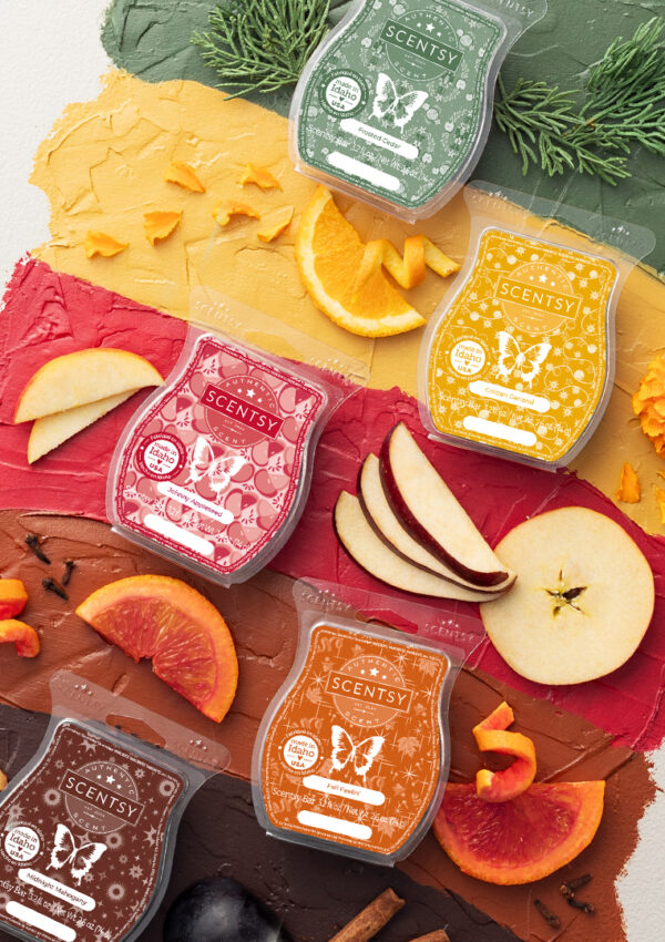 Scentsy wax bars scented in fall fragrance with fall fruits, flowers, spices and greenery all around.
