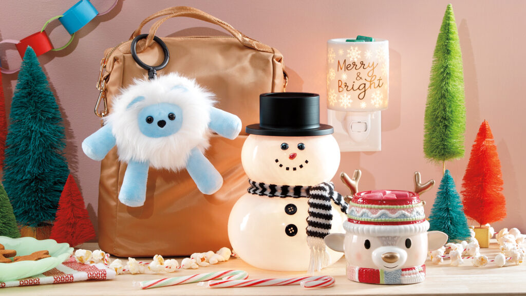 Products from Scentsy 2023 Holiday Collection including retro reindeer mini warmer, merry and bright mini warmer, yeti buddy backpack clip and snow cute snowman wax warmer