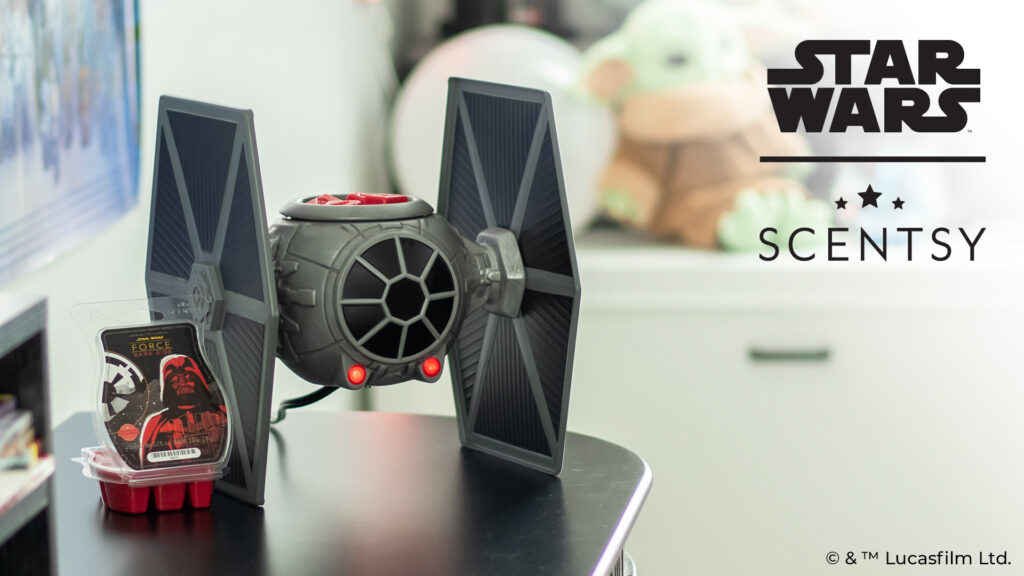 The Tie Fighter wax warmer and Star Wars™: Dark Side of the Force Scentsy wax melts sitting on an entertainment center