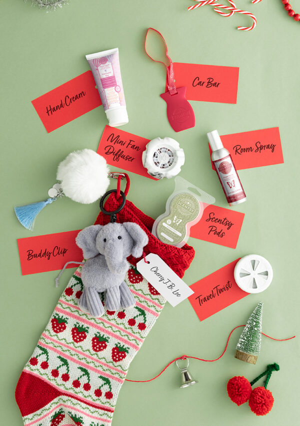 A festive, holiday-themed collage of different Scenty products from the Scentsy Holiday Collection.