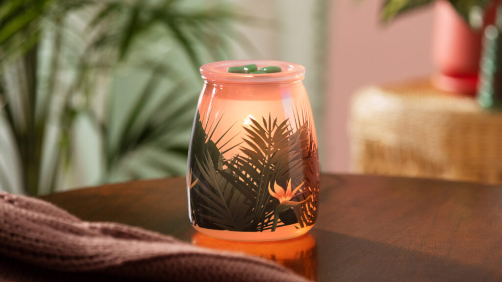 The exotic Birds of Paradise Wax Warmer melting cubes of a Coconut Lemongrass Scentsy Bar 