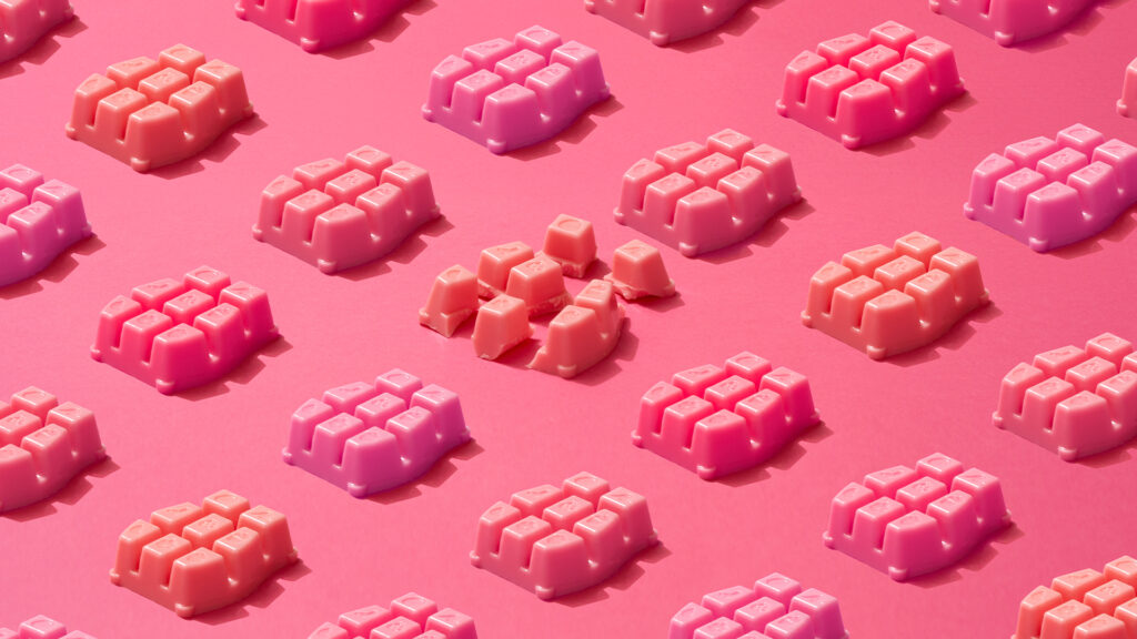 A stylized image of Scentsy wax bars all in various red or pink hues.