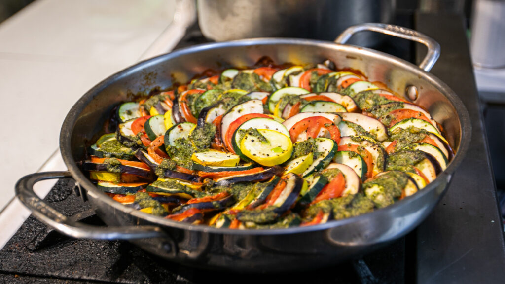 A skillet full of the ingredients for ratatouille.