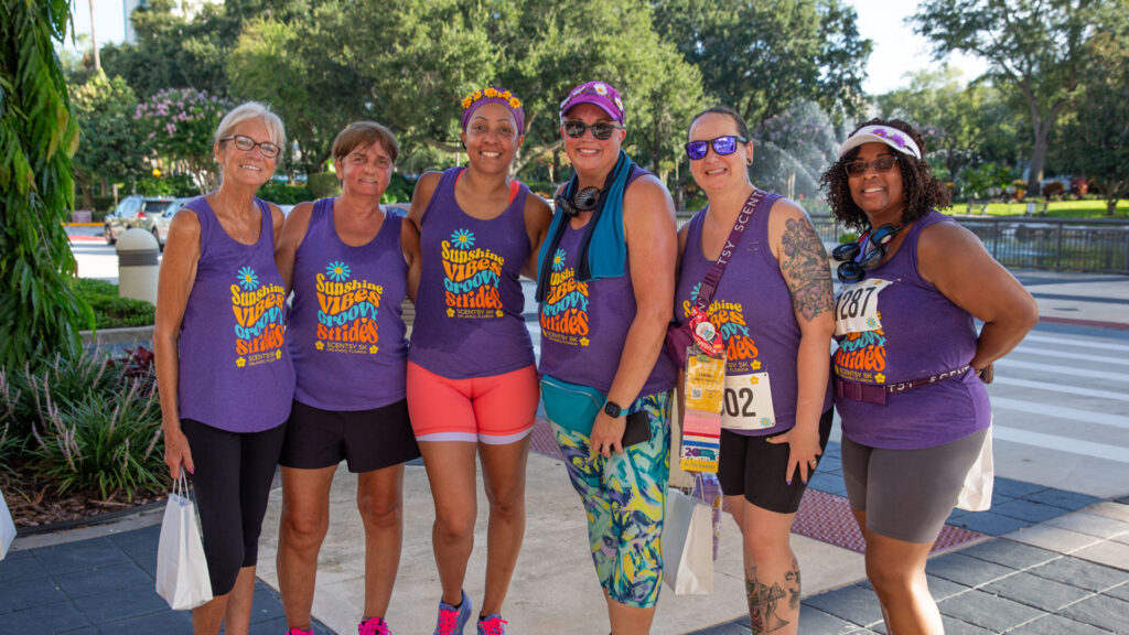 Top contenders in the 70's themed Scentsy 5K event pose after their race.