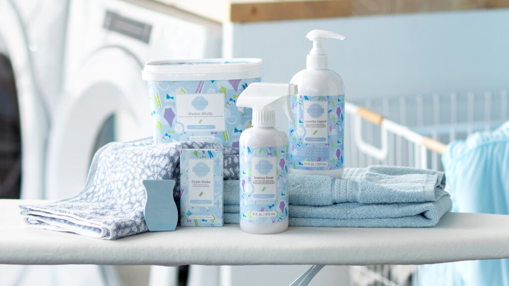 Scentsy Laundry products asembled on an ironing board.