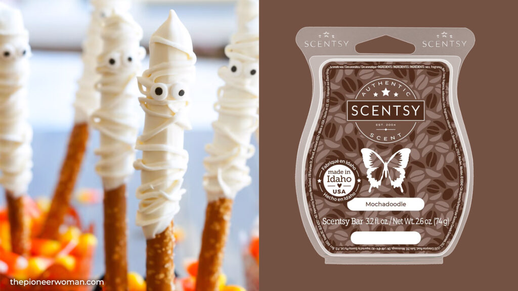 A vertical split collage image with a halloween, ghost themed white chocolate drizzled pretzel on one side and a Mochadoodle Scentsy Wax Bar on the other. 