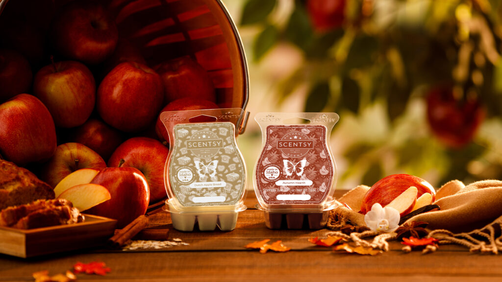 Scentsy Autumn Hearth and Dutch Apple Bread Wax bars positioned among apples, cinnamon sticks, and autumn flowers.